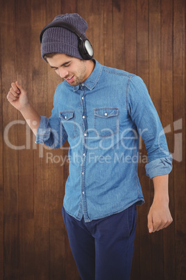 Hipster wearing headphones enjoying music