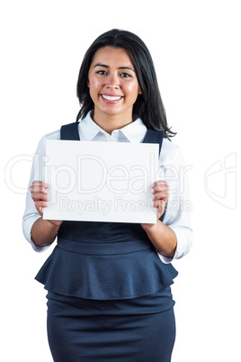 Happy woman holding a white sheet of paper