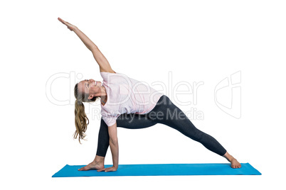 Fit woman exercising on mat