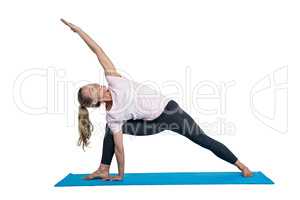 Fit woman exercising on mat