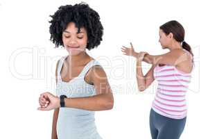 Fit woman checking time on wristwatch