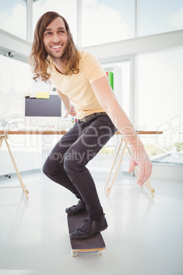 Hipster smiling while skateboarding