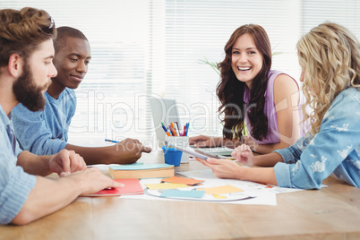 Portrait of smiling woman working with coworkers