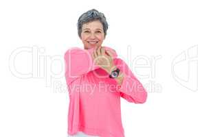 Portrait of cheerful mature woman stretching