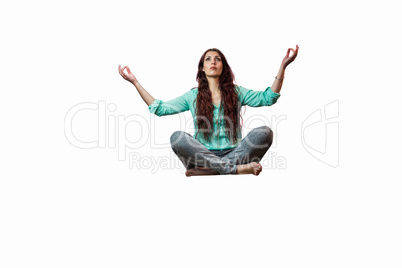 Full length of woman levitating with arms raised