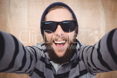 Portrait of happy hipster wearing sunglasses