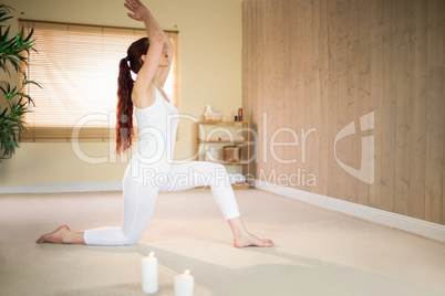 Side view of woman meditating with joined hands