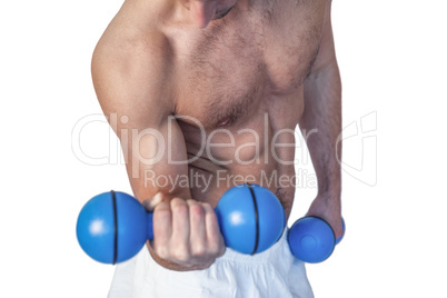 Midsection of a man holding dumbbells