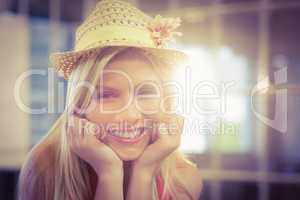 Portrait of happy businesswoman wearing hat