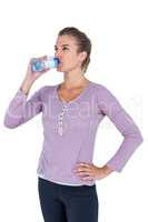 Young beautiful woman drinking water