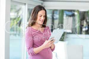 Happy businesswoman using digital tablet