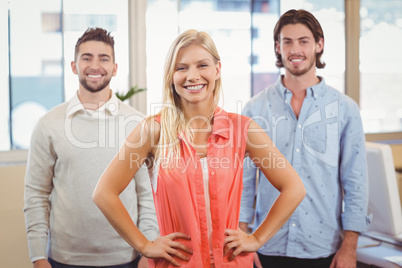 Businesswoman standing with male colleagues