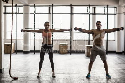 Two fit people doing fitness