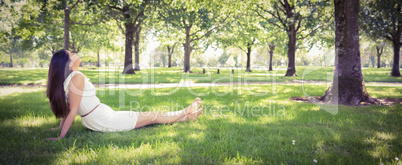 Young woman relaxing on grassland