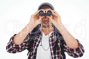 Hipster looking through binoculars