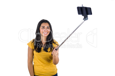 Attractive woman using a selfie stick