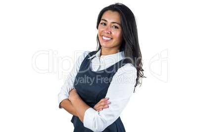 Woman smiling with her arms folded