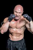 Angry bald fighter with gloves