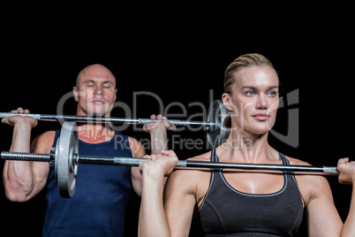 Strong man and woman lifting crossfit
