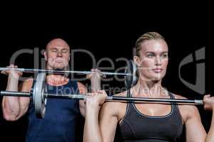 Strong man and woman lifting crossfit