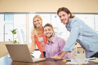 Portrait of business people with laptop