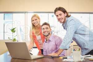 Portrait of business people with laptop