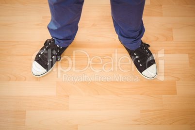 Man standing on hardwood floor