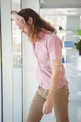 Hipster looking through window