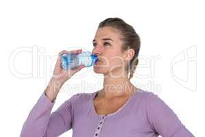 Close-up of young beautiful woman drinking water