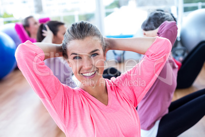 Portrait of sporty woman doing sit ups