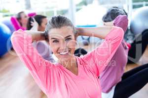 Portrait of sporty woman doing sit ups