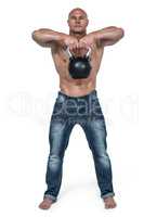 Portrait of bald man exercising with kettlebell
