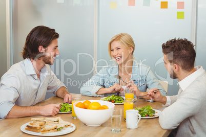 Business people laughing during lunch