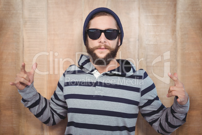 Hipster showing rock and roll hand sign
