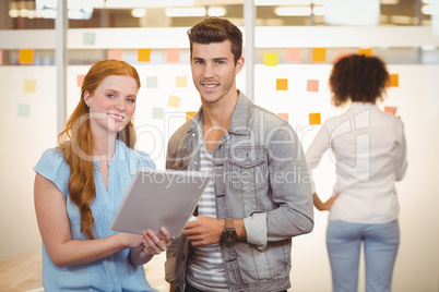 Portrait of business people looking at document