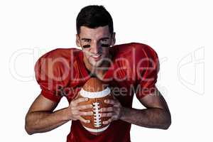 Portrait of serious player holding rugby ball