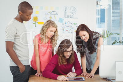 Man using digital tablet with business team Man using digital tablet with business team