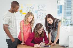 Man using digital tablet with business team