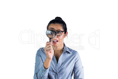 Woman examining with a magnifying glass