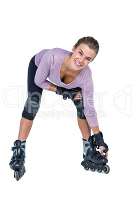 Portrait of happy woman inline skating