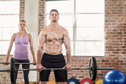 Two fit people working out