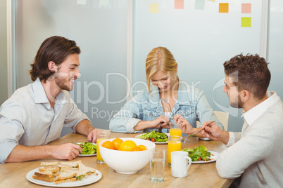 Business people having lunch in office