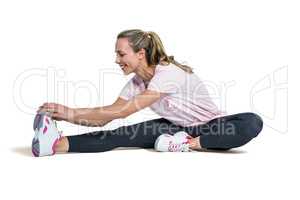 Sporty woman exercising over white background