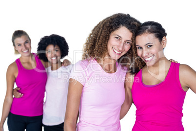 Portrait of happy women with arms around