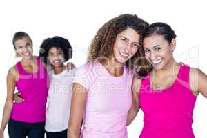 Portrait of happy women with arms around