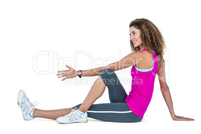 Side view of young woman exercising