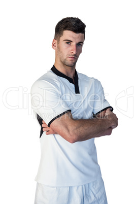 Portrait of a rugby player with arms crossed