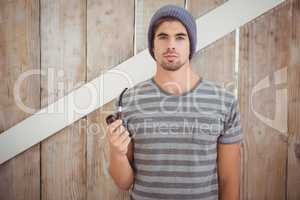 Portrait of hipster holding smoking pipe