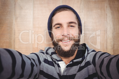 Portrait of happy hipster with hooded shirt