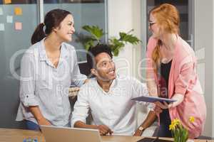 Happy business people at desk